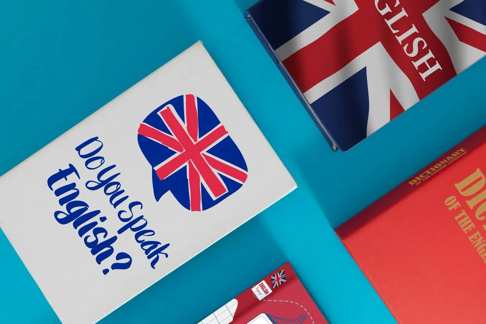 Podręczniki i słownik języka angielskiego "Do You Speak English?" na niebieskim tle